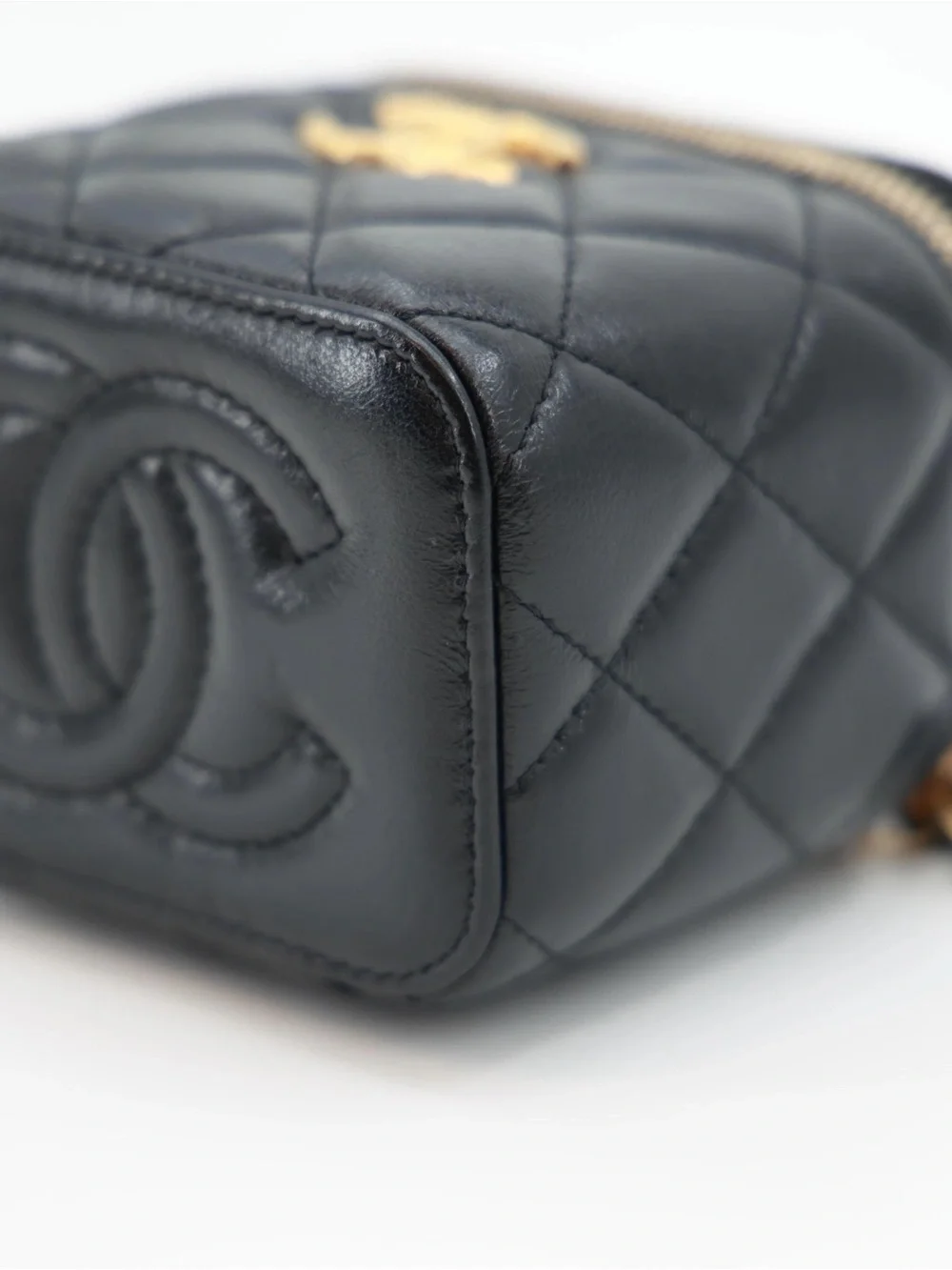 CHANEL Black Quilted Lambskin Mini Vanity Case with Gold Carving CC